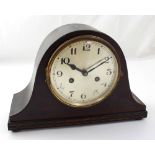 A mid-20th century Napoleon hat eight-day mantel clock, gilded dial set with Arabic numerals.