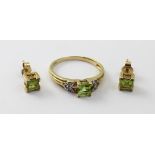 A 9ct gold peridot and white topaz ladies' dress ring,