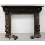 A 19th century heavily carved Gothic-style fire surround,