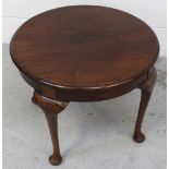 An Art Deco mahogany circular coffee table with plain gallery on four cabriole legs to pad feet,