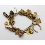 A 9ct gold charm bracelet with a selection of mainly gold charms, approx 50g.