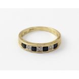 A 9ct gold diamond and sapphire half eternity ring, approx 2g.