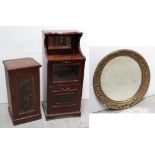 An Edwardian mirror-back cabinet, rectangular mirror over drop-down top with glass panel,