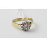 An 18ct gold ladies' diamond daisy ring, size K, approx 3.4g.