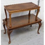 A reproduction-style coffee table on cabriole supports and a smaller teak carved non-matching