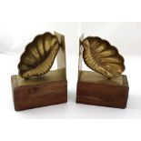 A pair of vintage wooden and brass bookends in the form of shells (2).