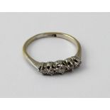 An 18ct yellow gold five stone diamond ring, size O, approx 2.3g.