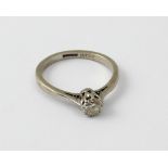 An 18ct white gold diamond siolitaire ring set with 25 point stone, size O, approx 3.2g.