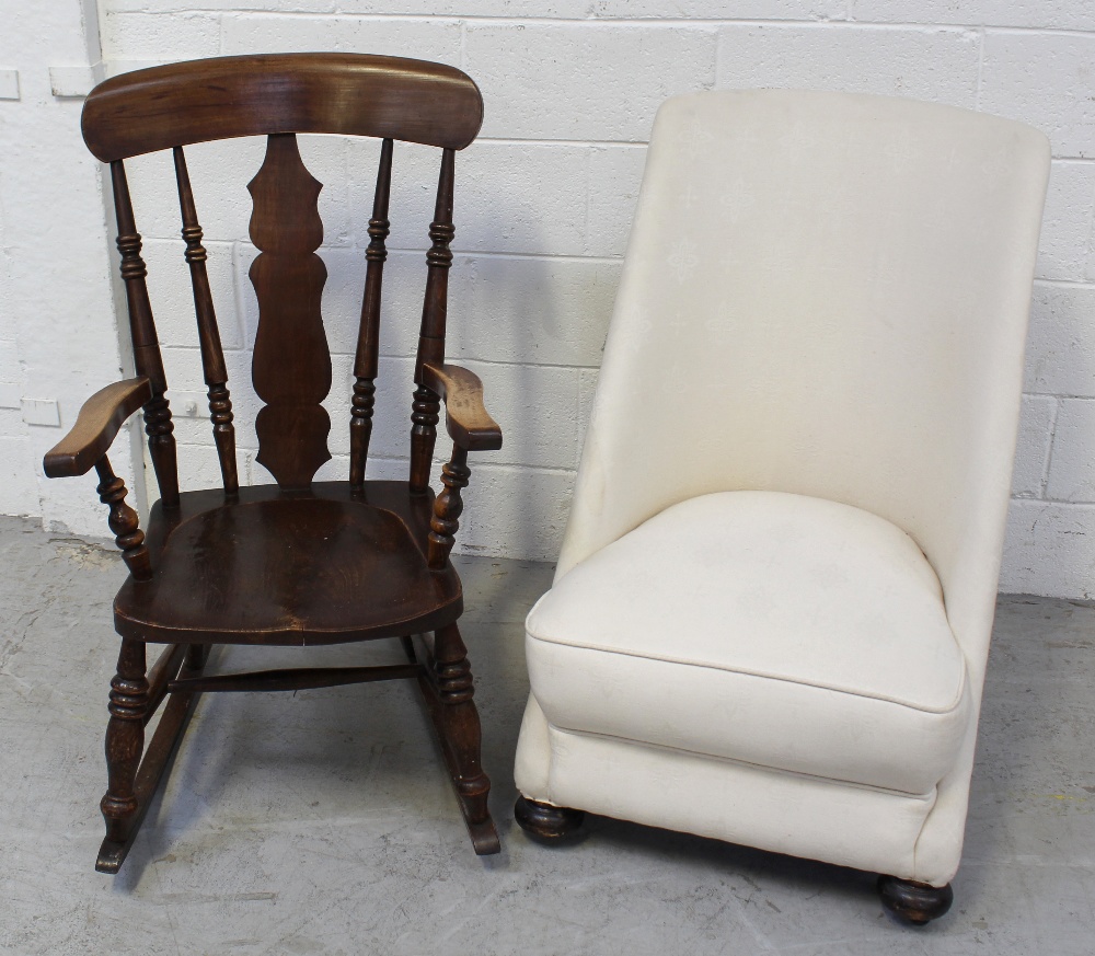 An early 20th century oak country-style rocking chair,