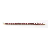 A 9ct gold link bracelet with twenty-one rubies, gem weight 13.596ct, with certificate.