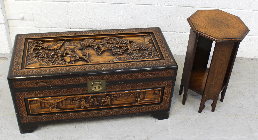 A 20th century Oriental carved camphor chest of small proportions decorated with flora and figures,