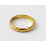 A 22ct gold ladies' wedding band, size K, approx 3.6g.
