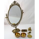 An oval ornamental dressing table mirror in filigree frame,