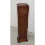 An oak-cased Art Deco short floor-standing longcase clock, the face set with Arabic numerals,