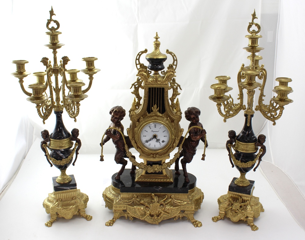 A Louis XVI style lyre-shaped clock and garniture, the clock in black marble,