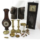 An early 20th century wall clock in oak case and an oak-cased aneroid barometer,