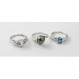 Three 9ct white gold ladies' dress rings to include one set with 'Swiss Blue' topaz, size N,