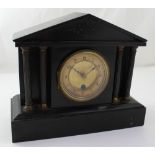 A Victorian black slate mantel clock of architectural form, 27 x 32cm.