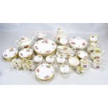 A Royal Worcester 'Roanoke' pattern decorated eight setting dinner and teaware including a tureen