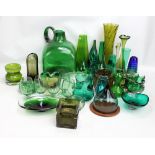 A large collection of green tinted glass including vases, large rounded square sectioned jug,