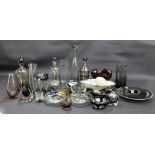 A collection of grey and smoked glass including decanters, vases, shallow bowls, ashtray,