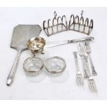 A group of variously hallmarked silver items to include a pair of small lancet shaped four division