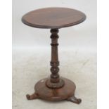 A Victorian rosewood circular occasional table, height 61cm.