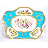 A late 19th century Minton porcelain shaped tray with foliate scroll twin handles,