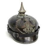 A Prussian WWI period leather Pickelhaube with spike and eagle plate to front,