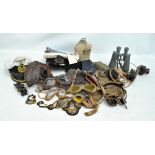 A mixed lot of military uniform and equipment to include flying goggles, headphones and mouthpiece,