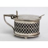 ARTHUR COOK; a Victorian hallmarked silver mustard pot of oval form with pierced sides,