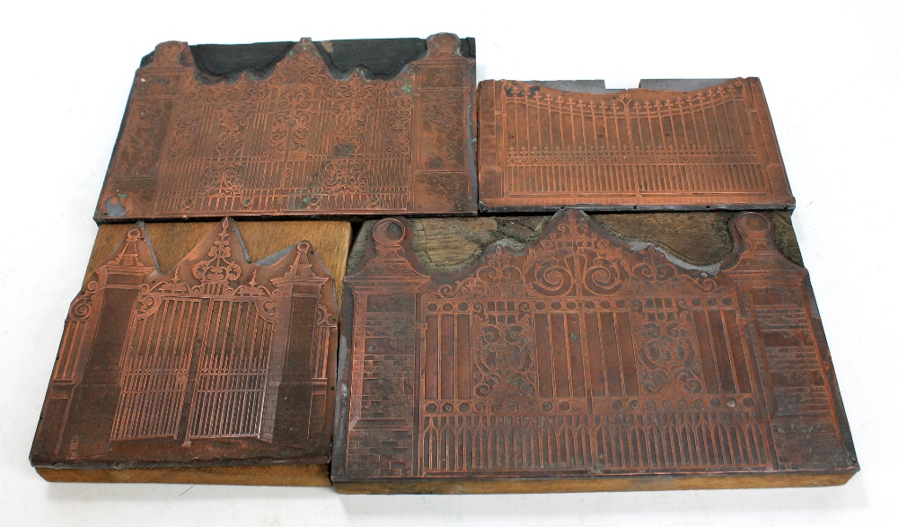 Four wooden and copper printing blocks depicting various designs of ornamental gates,