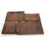 Four wooden and copper printing blocks depicting various designs of ornamental gates,