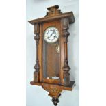 A late 19th century Vienna style wall clock,