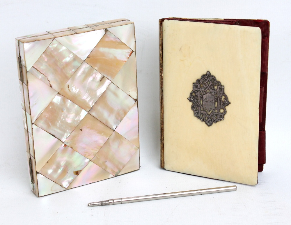 A 19th century ivory covered and silk lined card case with applied white metal cartouche inscribed