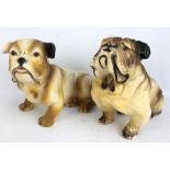 Two plaster bulldogs, length of each approx 44cm.