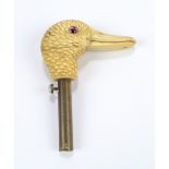 A late 19th century carved ivory duck's head from a novelty walking cane,