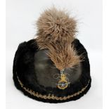 An early 20th century RAF officer's dress helmet and plume with cap badge,