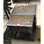 A nest of three oak occasional tables and a carved oak stool with hinged seat (2).