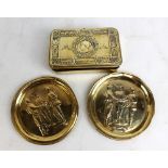 A WWI Christmas 1914 tin (lacking contents) and two brass dishes with military figures in relief to