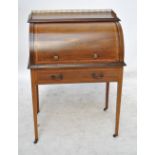 An Edwardian mahogany satinwood banded cylinder roll top desk, width 76.5cm.