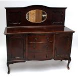 An early 20th century mahogany mirror back sideboard raised on cabriole front legs.