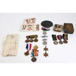 A WWI and WWII two generation family group of medals comprising three WWI trios awarded to three