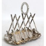 An electroplated four section golf related toast rack with ribs modelled as crossed golf clubs,