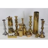 A mixed lot of brassware to include a miner's lamp, shell casing, candlesticks, etc.