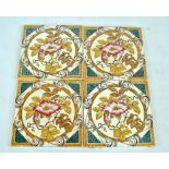 A set of four Mintons & Co floral decorated tiles, each 15.2 x 15.2cm (4).