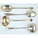 A FLERON; a pair of late 19th century Danish silver sauce ladle with cast decorated finials,