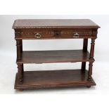 A late 19th century French oak buffet, the hinged top above vacant aperture (lacking marble),