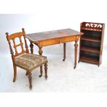 A Victorian oak writing desk with a leather top inset desk and hinged compartment,