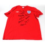 ENGLAND; a replica 1966 style shirt with nine signatures including Sir Geoff Hurst, Nobby Stiles,